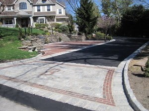 Driveway retaining wall belguim block blacktop stone